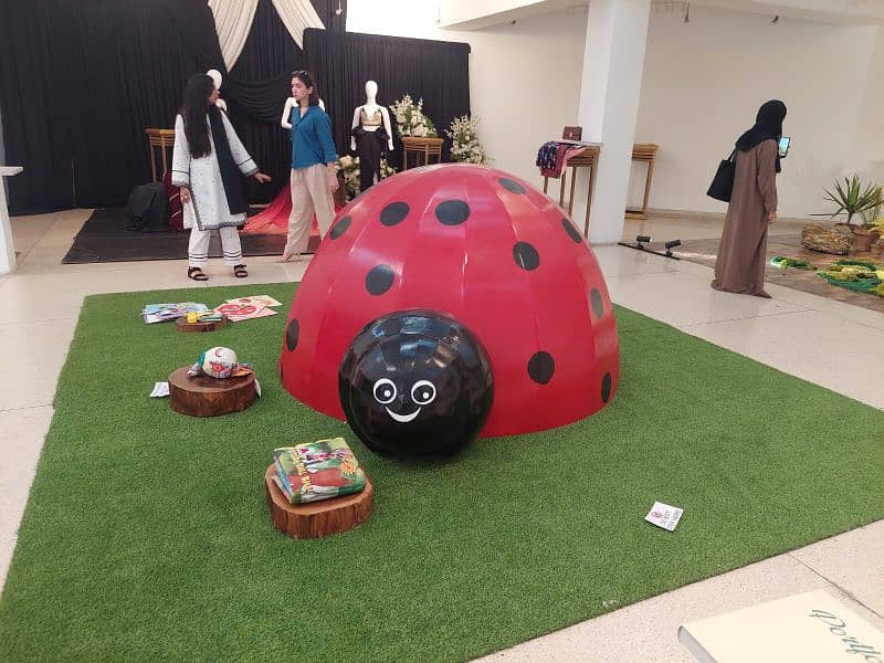 Wooden Ladybug House for kids with grass carpet 3