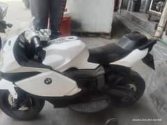 BMW 1300 color white electrical charging heavy bike.