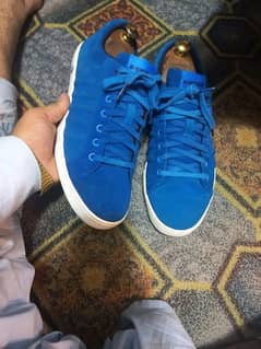 A pair of branded sneakers in low price 0