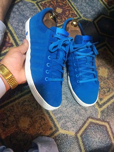 A pair of branded sneakers in low price 2