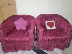 2 soft and comfy sofas with red covers