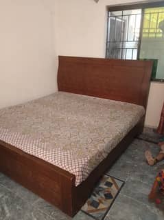 king size bed with mattress and side table