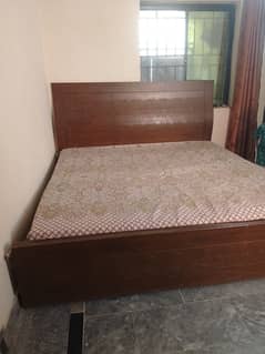 king size bed with mattress and side table