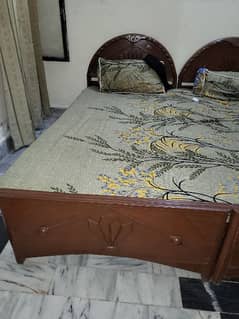 2 wooden single Beds