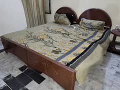 2 wooden single Beds