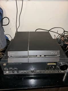 PlayStation 4 fat for sale with 2 gaming controllers 0