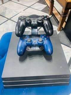 ps4 pro 4k 1tb with 2 original controllers and charging dock