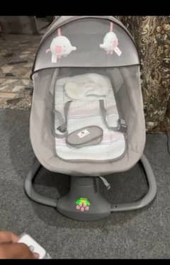 Electric baby swing/ baby cot