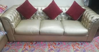 a golden poshish sofa 5seater like brand new