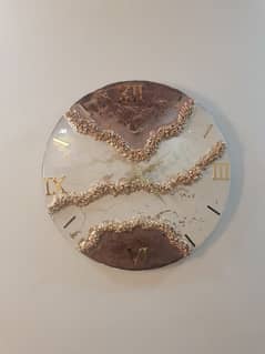 white and beige resin clock