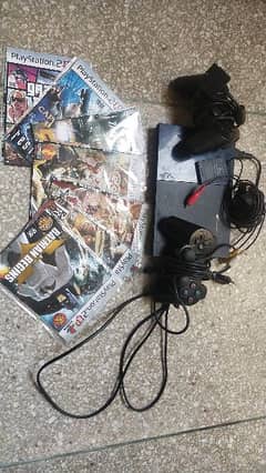 ps2 slim with 2 controllers and 7 games with all accessories