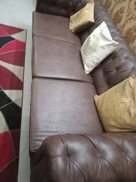 Leather seven seater sofa set including center table 10