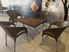 4 plastic chairs with 1 folding table