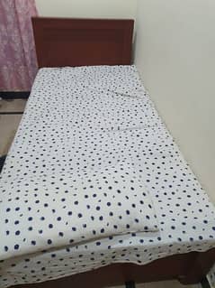 2 wooden single bed