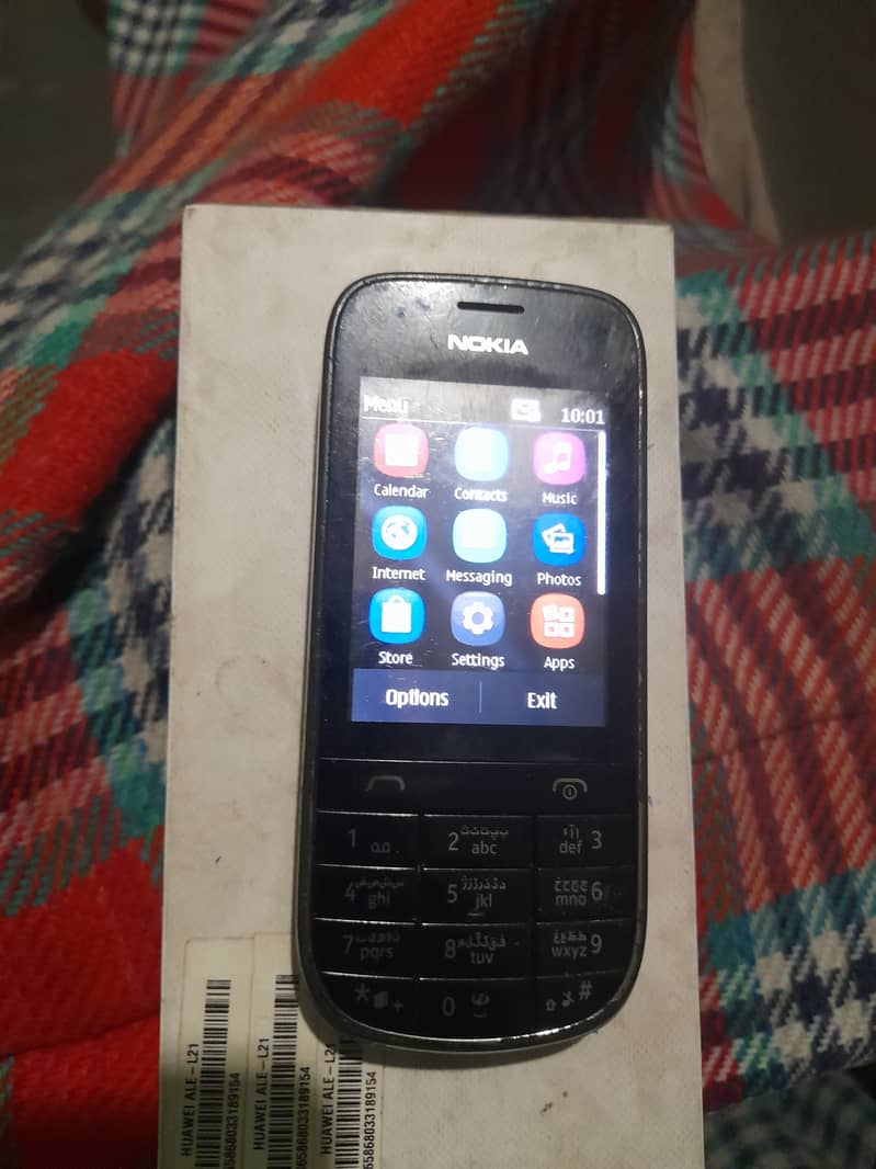 Huawei P8 Lite and Nokia Asha 202 ( Touch and Type ) 1