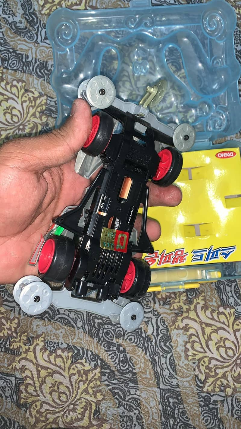 Get the 4WD Speed Racing Mini 4WD Action Car Toy for just 1050 PKR! 2