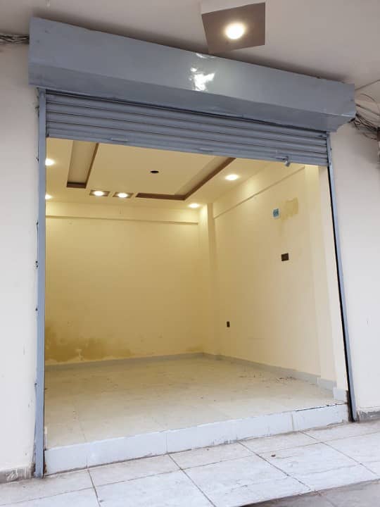 COMMERCIAL SHOP FOR SALE WITH GLASS DOOR ALLIANCE ON 100FT MAIN ROAD PRIME LOCATION OF NORTH KARACHI 11C 2