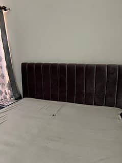 Grey cushion bed with 2 side table