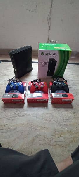 xbox 360 with games and 3 coloured controler just 1 month used 2