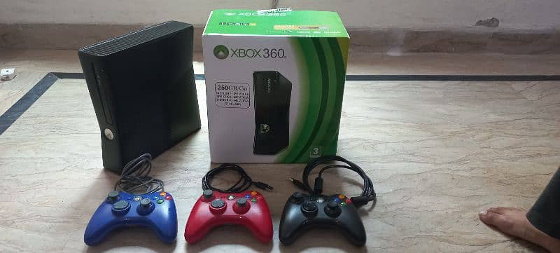 xbox 360 with games and 3 coloured controler just 1 month used 3