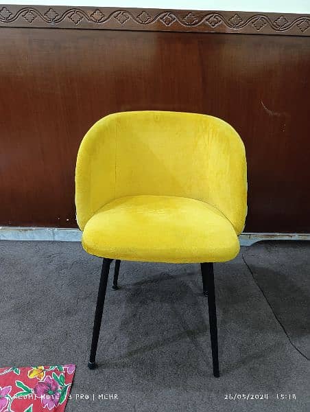 yellow white and black restaurant chairs 0