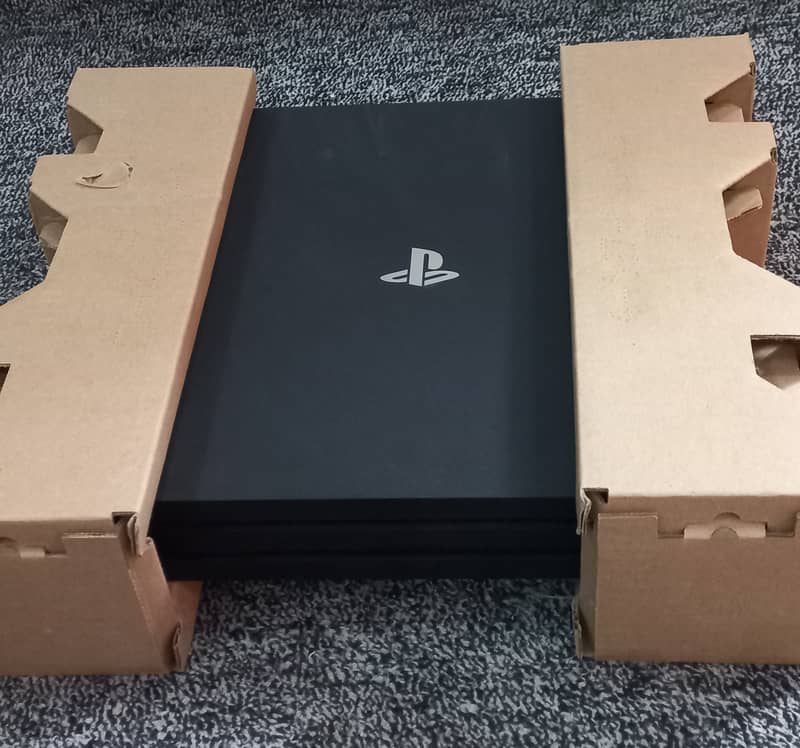 PS4 Pro 1TB with 1 controller,  1 Fighting /joy stick and 9 Games 2