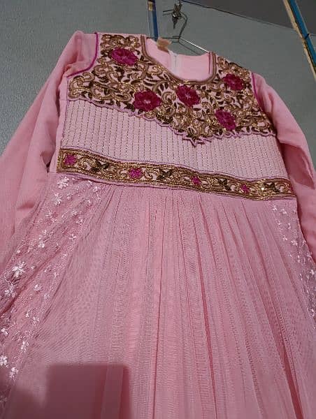 Baby pink frok with frill and belt to adjust size 1