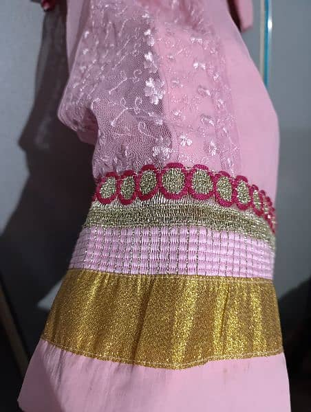 Baby pink frok with frill and belt to adjust size 4