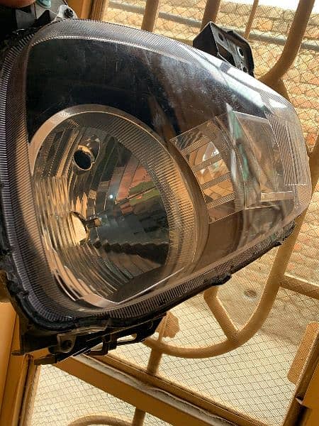 Alto headlight ( left ) 2