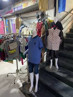 In running front location garment shop for sale with stock