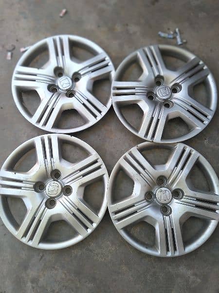 HONDA CITY GENUINE WHEEL CUPS FOR URGENT SALE IN 10/9 Condition. 1