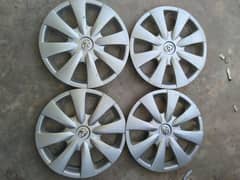 TOYOTA COROLLA WHEEL CUPS FOR SALE IN 10/8 CONDITION.