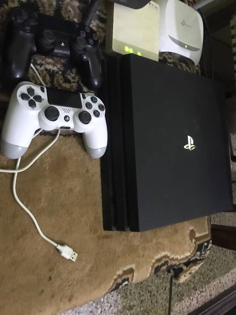 Playstation 4 Pto 1 TB With box & 2 Controllers 1