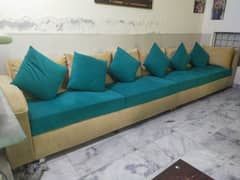 Aesthetic sea green and skin coloured L shape sofa.