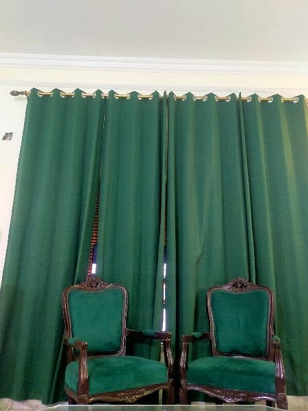 Simple aesthetic coloured (leaf green) chairs with 4 curtains. 0