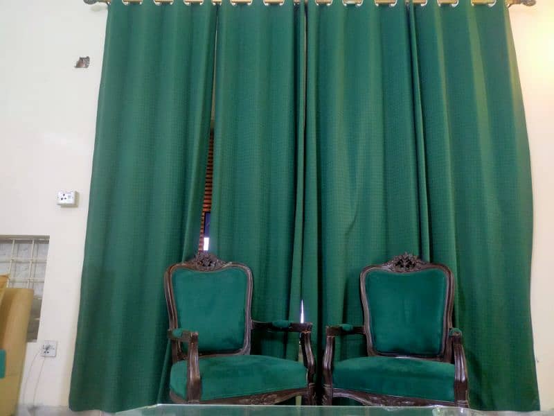 Simple aesthetic coloured (leaf green) chairs with 4 curtains. 1