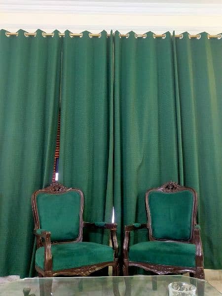 Simple aesthetic coloured (leaf green) chairs with 4 curtains. 2