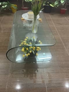 One piece of unbreakable glass molded into table