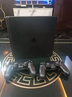 PLAYSTATION 4 SLIM WITH GTA 5 WITH 2 CONTROLLERS