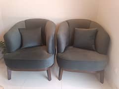 Two single seater sofas