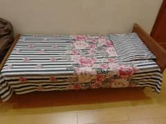 wooden single bed without mattress