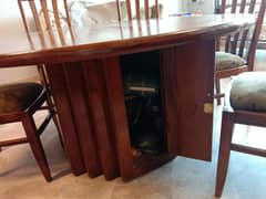 Round Dining Table with 6 Wooden Chairs and a Cabinet