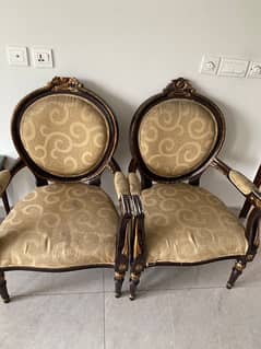 2 solid wood chairs with round table