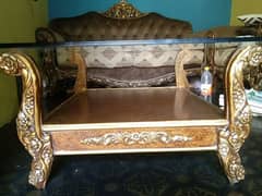 wooden sofa with Glass table