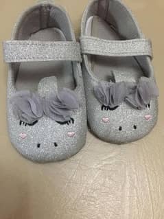 silver baby shoe