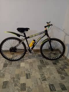 sportive cycle with front disc brakes and smooth jumpe, slightly used