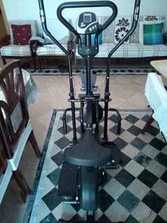 Unused Elliptical trainer with dumbells and twister