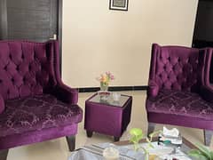 Purple armchairs with coffee table