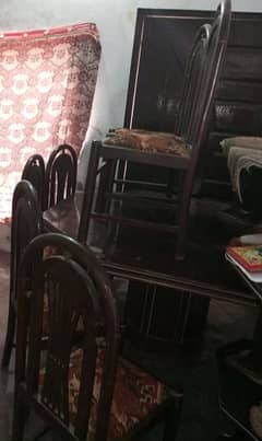dining table(large) with 6 wooden chairs. (rate can be reduced)