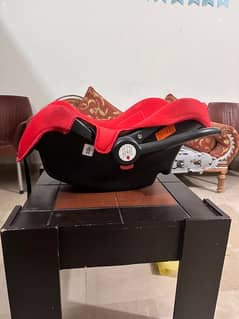 Baby cot plus used as a car seat both in one